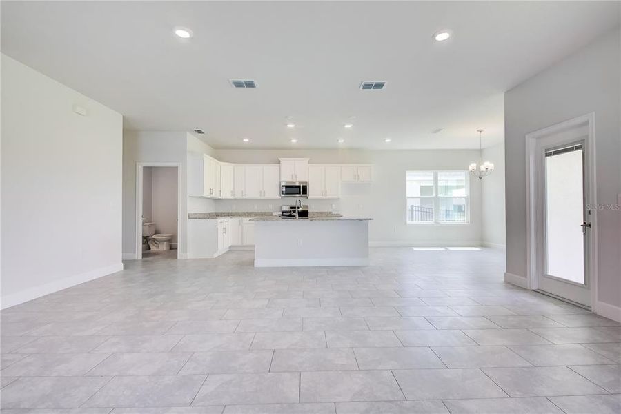 Spacious, unfurnished interior of a new home in Aviary at Rutland Ranch, Parrish (Image 13).