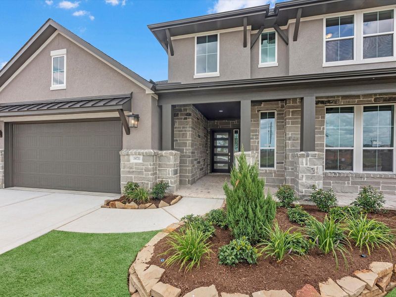Front exterior of a new home in Dunham Pointe, Cypress, TX, highlighting curb appeal (Image 16).