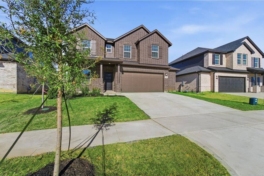 Front exterior of a new home in Sagebrook, Argyle, TX, highlighting curb appeal (Image 25). Front exterior of a new home in Sagebrook, Argyle, TX, highlighting curb appeal (Image 25).