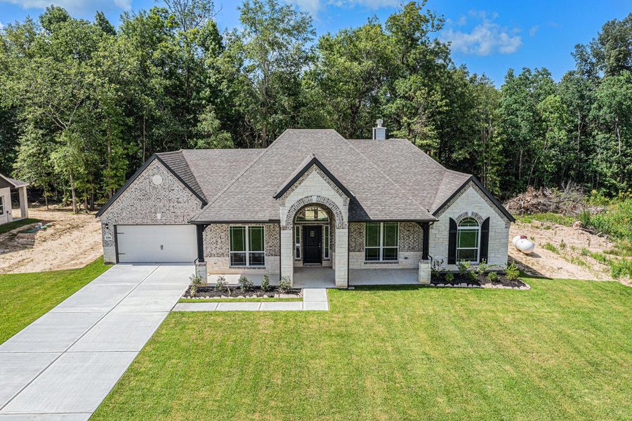 Front exterior of a new home in , Bay City, TX, highlighting curb appeal (Image 24).