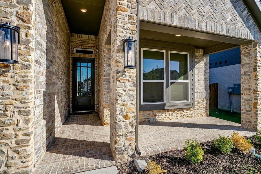 Beautiful rock work and decorative lighting welcomes you in. Covered front porch offers the perfect spot to sit and enjoy your favorite time of day!