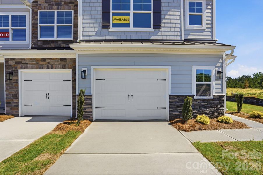 Front exterior of a new home in Blythe Mill Townhomes, Waxhaw, NC, highlighting curb appeal (Image 23).