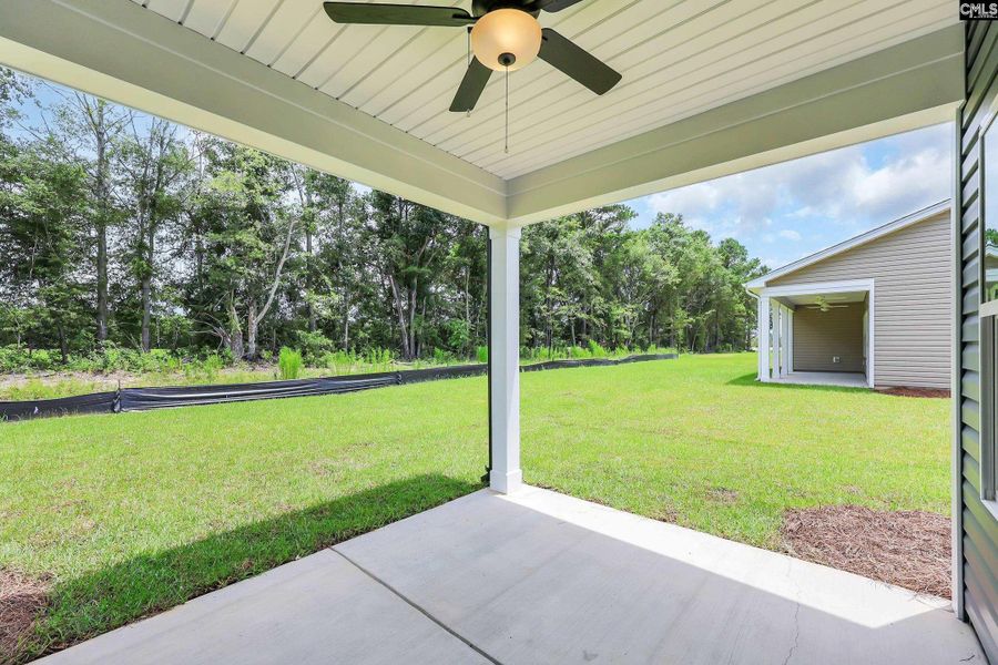 Exterior details and patio area of a home in Cottages at Roofs Pond, West Columbia (Image 2).