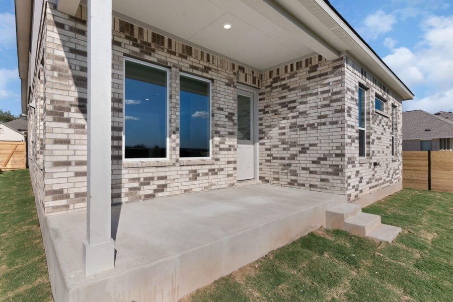 Exterior details and patio area of a home in Highland Village, Georgetown (Image 18).