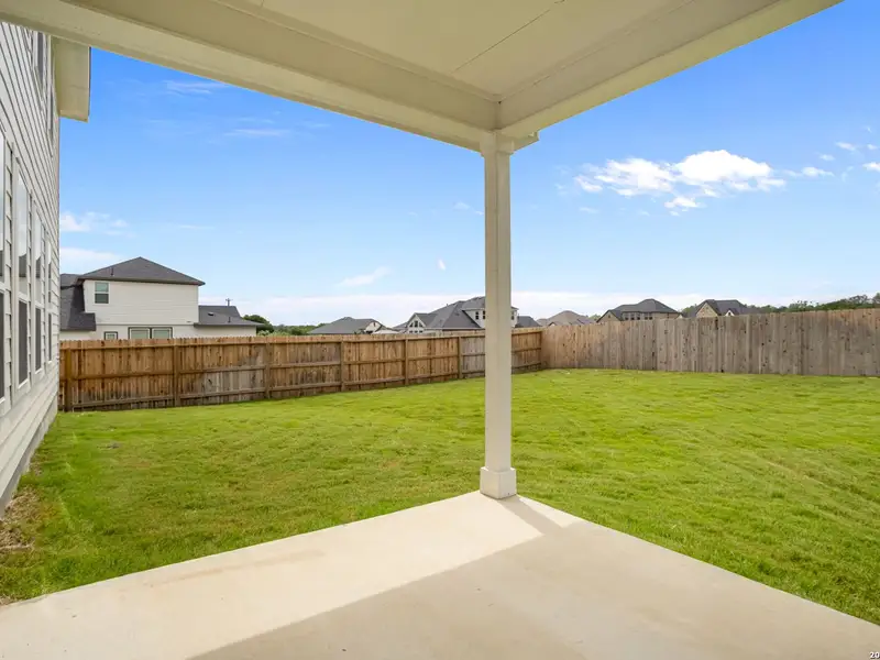 Exterior details and patio area of a home in The Reserve at Potranco Oaks, Castroville (Image 3).