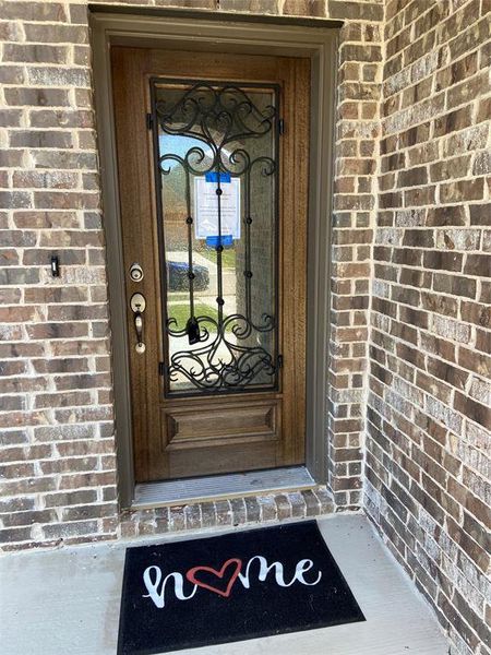 Great first impression with iron & glass front door. Great first impression with iron & glass front door.