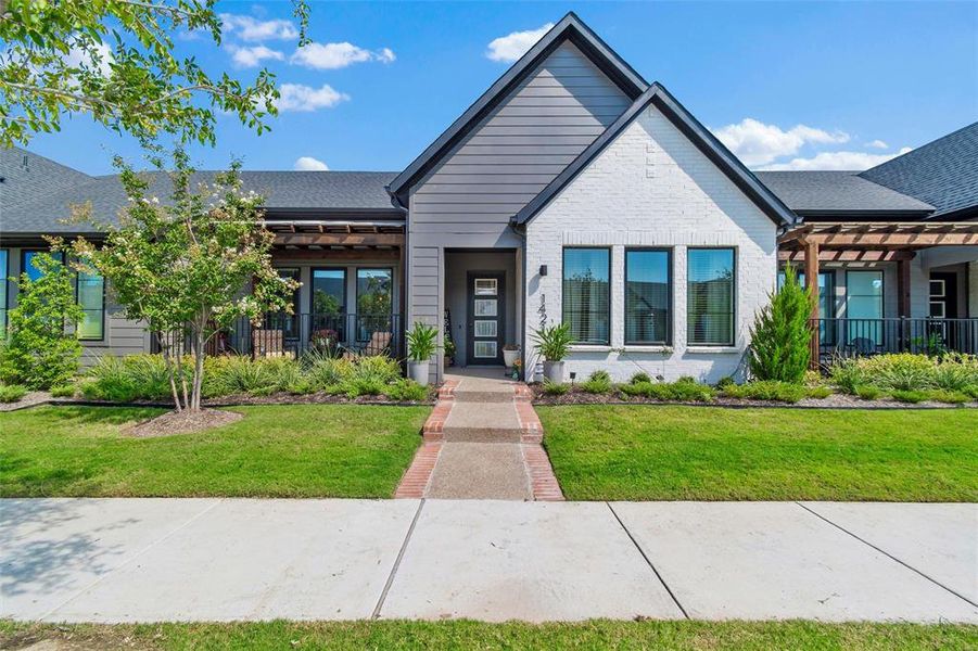 Front exterior of a new home in , Arlington, TX, highlighting curb appeal (Image 1).