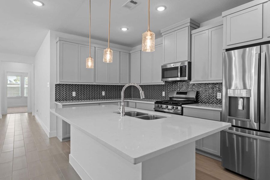 Furnished interior view inside a new home in Meridiana, Iowa Colony (Image 7).