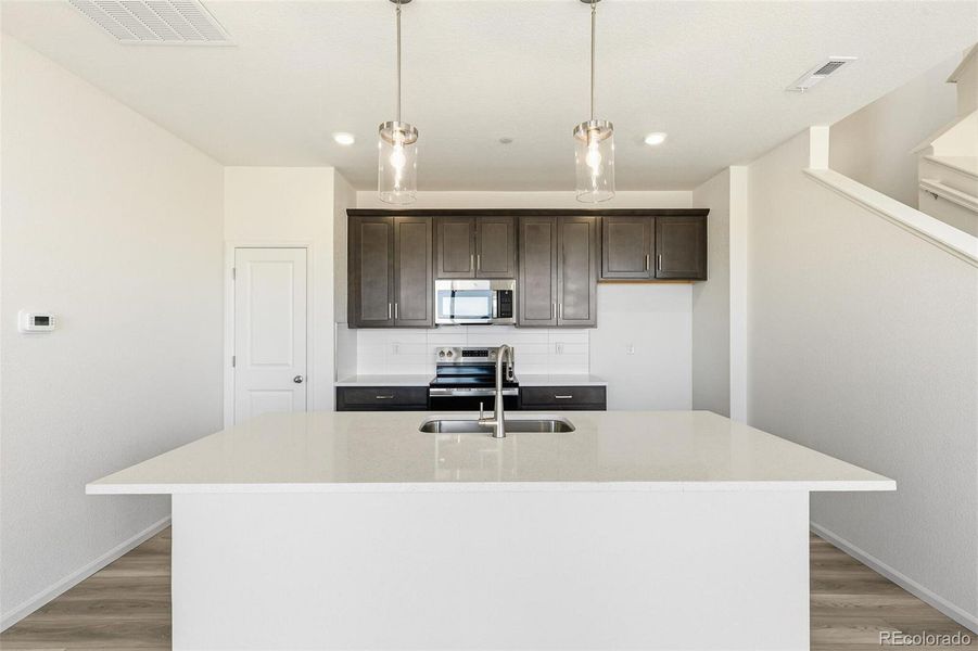 Furnished interior view inside a new home in Turnberry, Commerce City (Image 6).