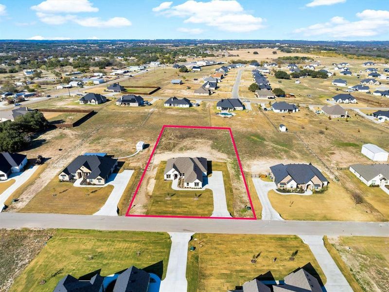 Front exterior of a new home in , Weatherford, TX, highlighting curb appeal (Image 26).