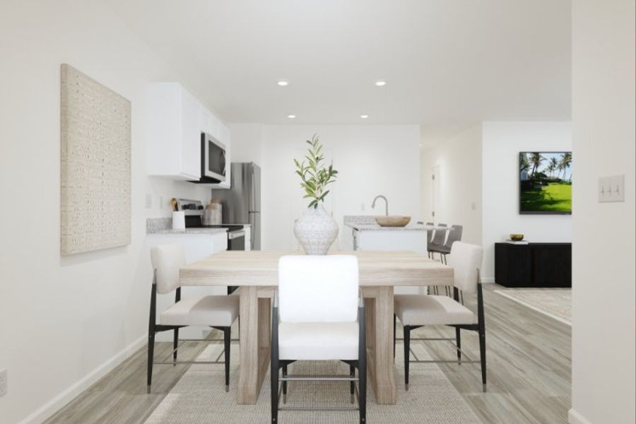 A dining room with a table and chairs.