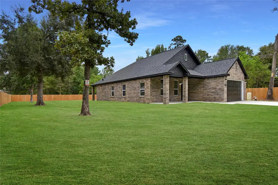 Exterior details and patio area of a home in , Conroe (Image 2). Exterior details and patio area of a home in , Conroe (Image 2).