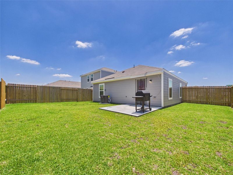 Exterior details and patio area of a home in Park Vista at El Tesoro, Houston (Image 29).