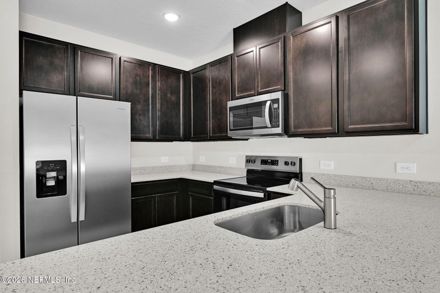 Furnished interior view inside a new home in Baxley Villas, Middleburg (Image 5).