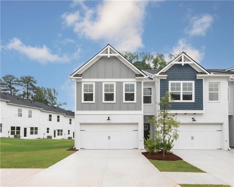 Front exterior of a new home in Old Salem Crossing, Conyers, GA, highlighting curb appeal (Image 1).
