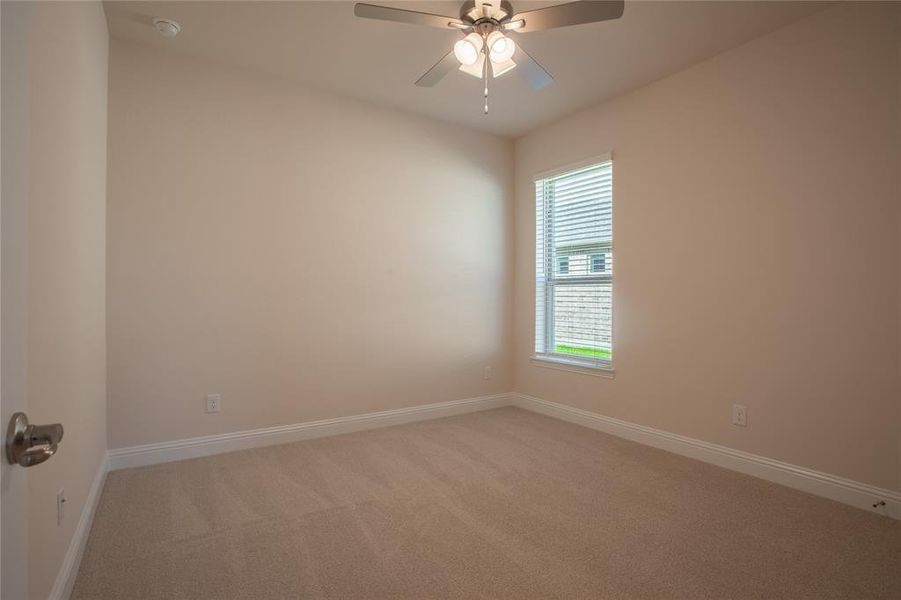 Unfurnished room with carpet and ceiling fan