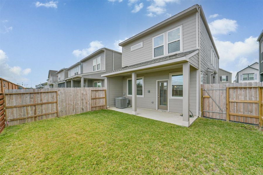 The home enjoys this pleasant outside lawn and covered patio. The home enjoys this pleasant outside lawn and covered patio.