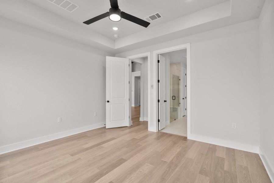 Primary Bedroom with tray ceiling Primary Bedroom with tray ceiling