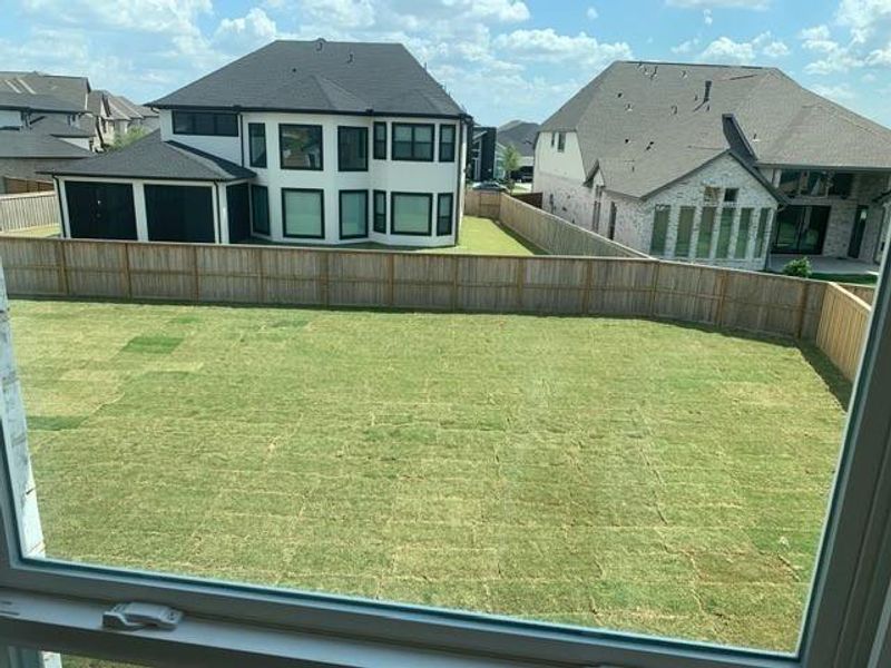 Exterior details and patio area of a home in Dunham Pointe, Cypress (Image 25).