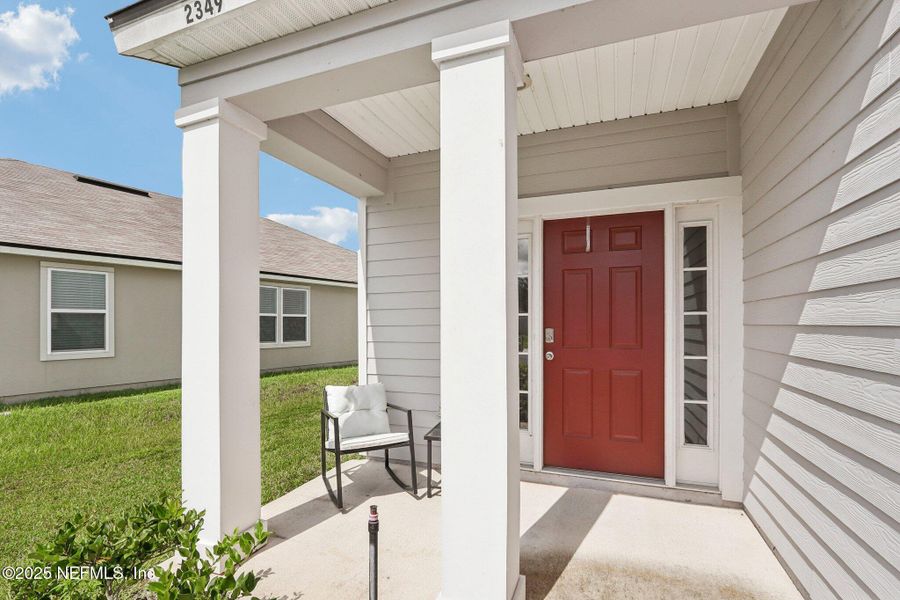 Front exterior of a new home in Cross Creek Express, Green Cove Springs, FL, highlighting curb appeal (Image 29).