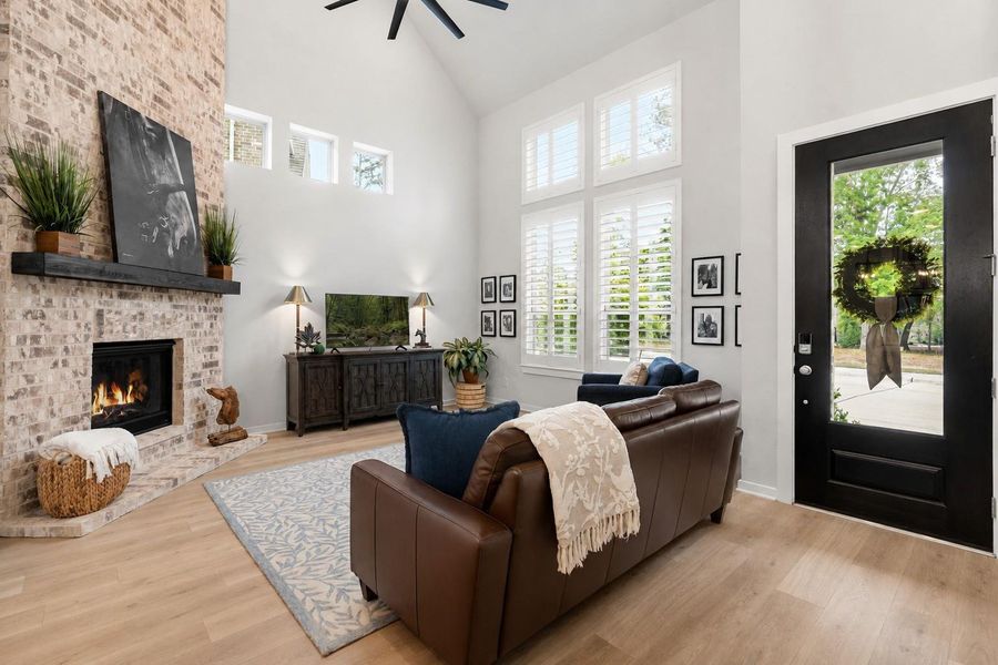 Enjoy a spacious entry and living area with plantation shutters and an abundance of natural light.