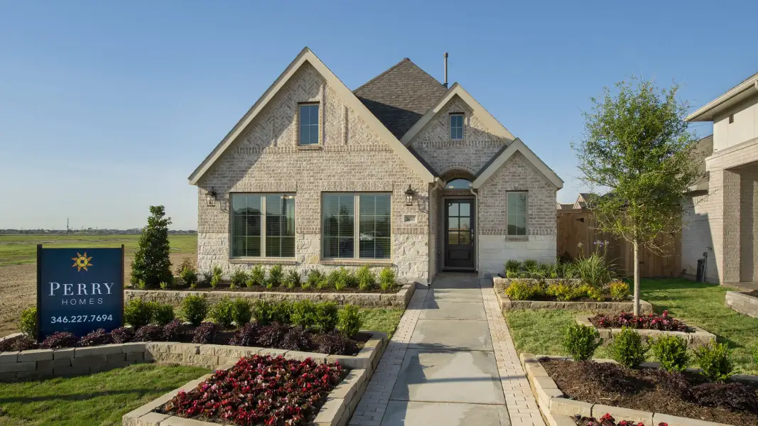 Front exterior of a new home in Woodhavyn, Magnolia, TX, highlighting curb appeal (Image 24).