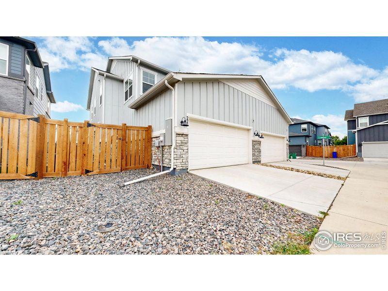 Front exterior of a new home in Fickel Farms, Berthoud, CO, highlighting curb appeal (Image 20).