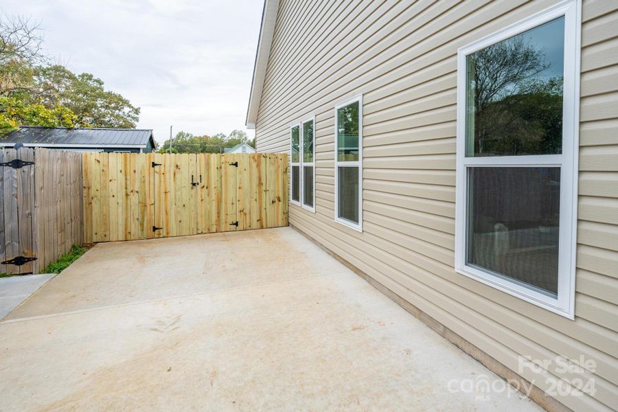 Cement Driveway w/Access Gate to Backyard