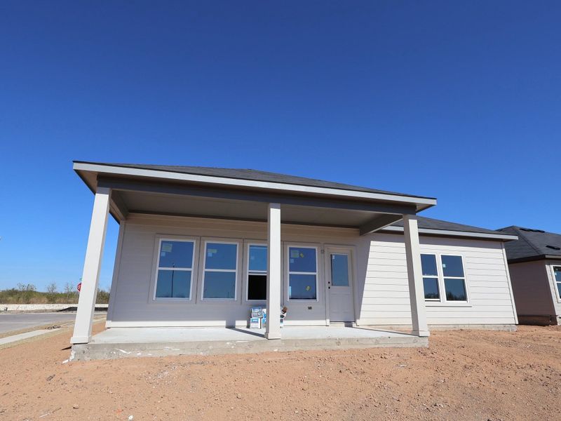 Exterior details and patio area of a home in Carillon, Manor (Image 8).