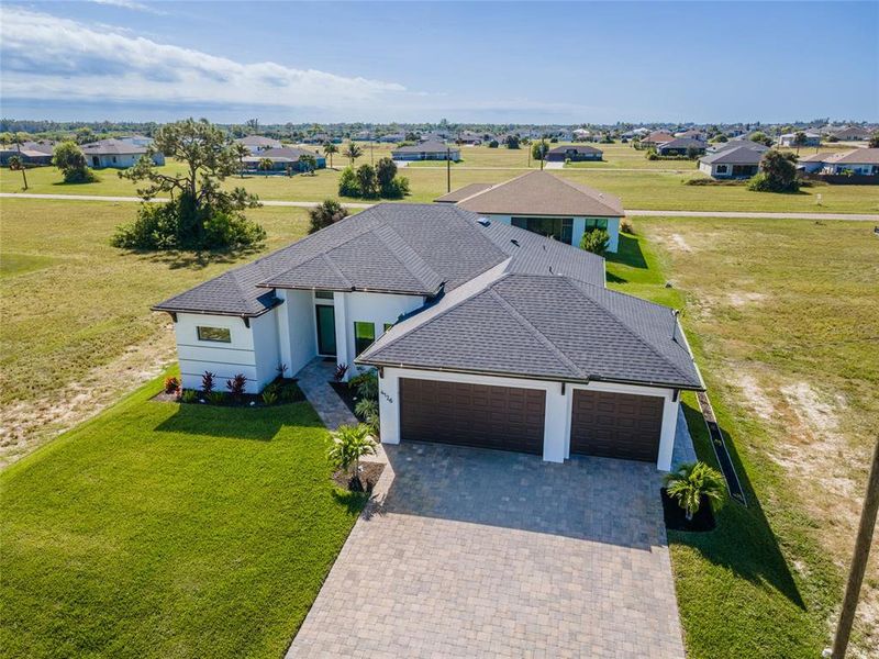 Front exterior of a new home in , Cape Coral, FL, highlighting curb appeal (Image 2). Front exterior of a new home in , Cape Coral, FL, highlighting curb appeal (Image 2).