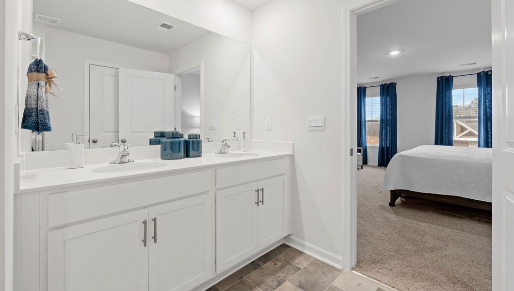 Furnished interior view inside a new home in Bentley Park, Greenwood (Image 32).