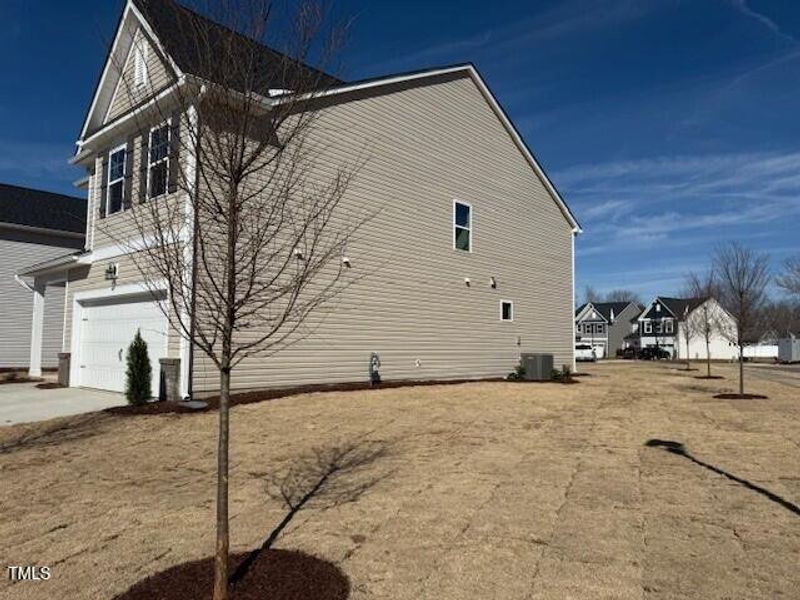 Front exterior of a new home in Gregory Village, Lillington, NC, highlighting curb appeal (Image 11). Front exterior of a new home in Gregory Village, Lillington, NC, highlighting curb appeal (Image 11).