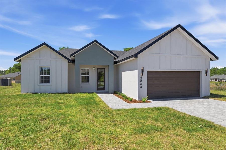 Front exterior of a new home in , Ocala, FL, highlighting curb appeal (Image 19).