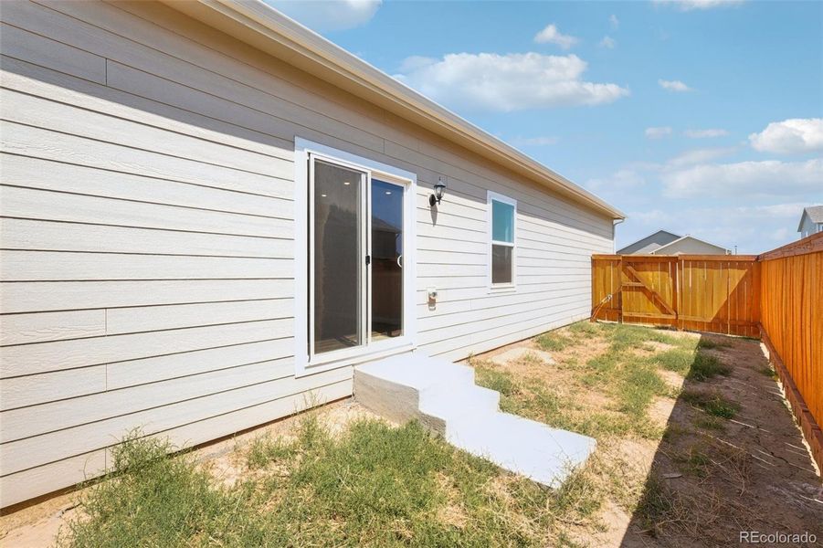 Front exterior of a new home in Wolf Creek Run, Strasburg, CO, highlighting curb appeal (Image 15).