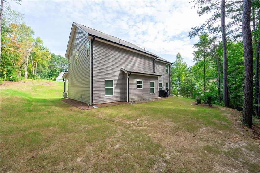 Front exterior of a new home in , Dallas, GA, highlighting curb appeal (Image 22).