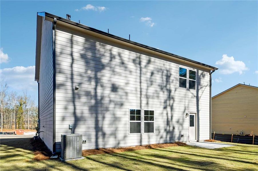 Exterior details and patio area of a home in The Pointe at Heron Bay, Locust Grove (Image 4).