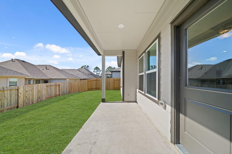 Exterior details and patio area of a home in Lexington Heights, Willis (Image 4). Exterior details and patio area of a home in Lexington Heights, Willis (Image 4).