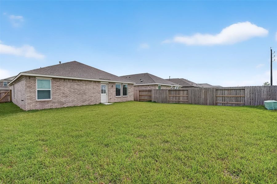 The corner lot gives the house a large backyard.
