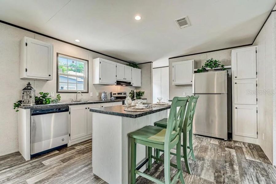 Furnished interior view inside a new home in , Okeechobee (Image 5).