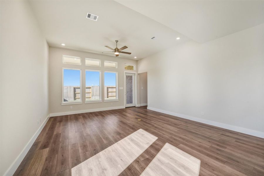 Spacious, unfurnished interior of a new home in Sunterra, Katy (Image 29).