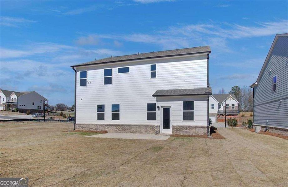 Exterior details and patio area of a home in The Paddocks at Doc Hughes, Buford (Image 3).