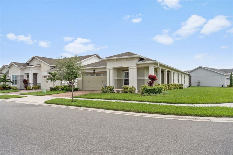 Front exterior of a new home in , St. Cloud, FL, highlighting curb appeal (Image 21).