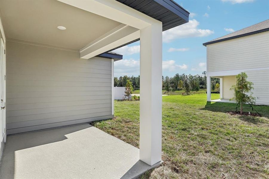 Exterior details and patio area of a home in Trailside, Mount Dora (Image 13).