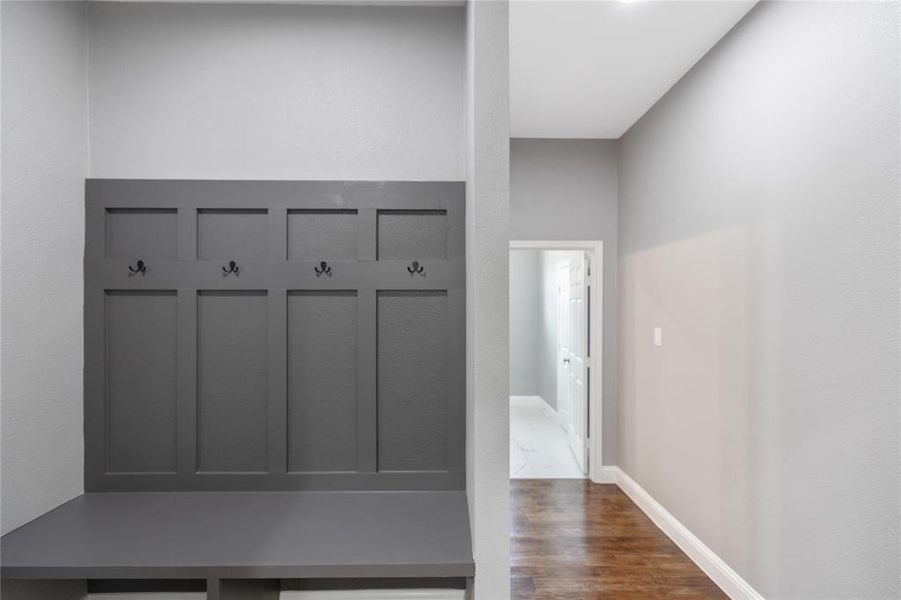 Mudroom with dark wood-type flooring