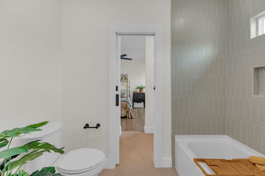 Jack and Jill bathroom with tub view.