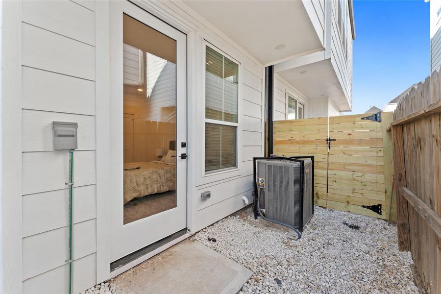 Exterior details and patio area of a home in Jensen Villas, Houston (Image 22).