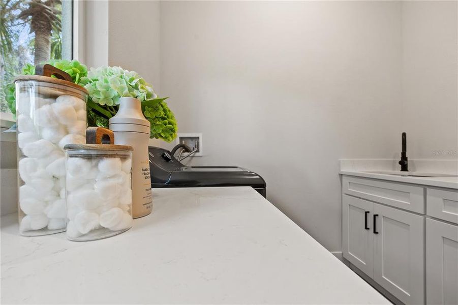 Walk in Laundry with Built in Sink Cabinetry and Washer / Dryer Walk in Laundry with Built in Sink Cabinetry and Washer / Dryer