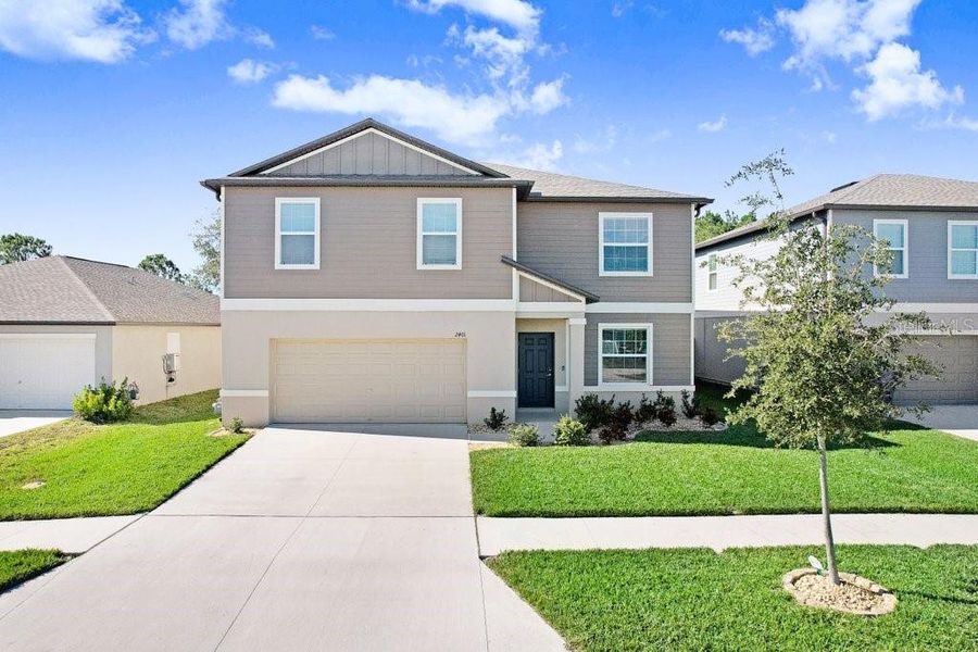 Front exterior of a new home in , Zephyrhills, FL, highlighting curb appeal (Image 26). Front exterior of a new home in , Zephyrhills, FL, highlighting curb appeal (Image 26).