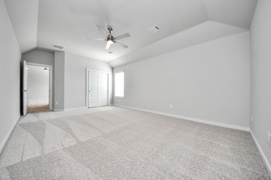 Generously sized secondary bedrooms featuring spacious closets, soft and inviting carpeting underfoot, large windows allowing plenty of natural light, and the added touch of privacy blinds for your personal retreat.