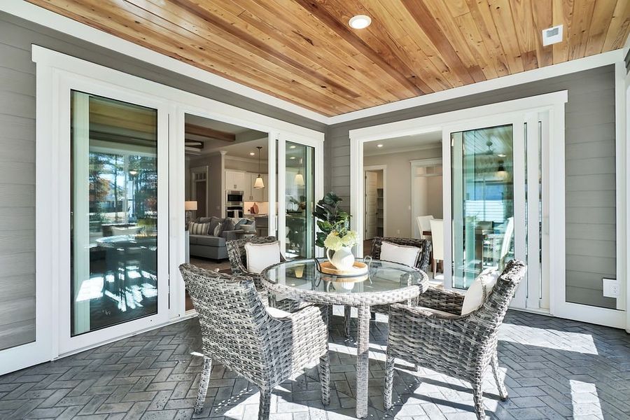 Exterior details and patio area of a home in The Bluffs On the Cape Fear, Leland (Image 4).